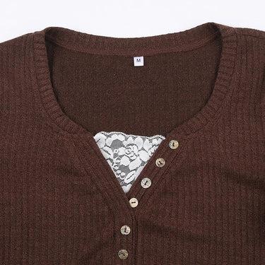 Three-quarter view of top showing sleeve length and cuff detail