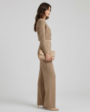 Close-up of the asymmetric layered detail on the knit top