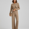 Front view of a knit co ord set with asymmetric top and wide-leg trousers