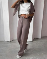 Close-up of ribbed knit texture on sweater and matching trousers