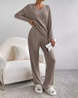 Flat lay of the ribbed knit top and wide-leg trousers side by side