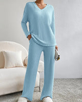 Close-up of the ribbed knit waistband on the wide-leg trousers