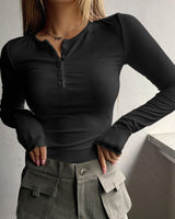 Back view of the ribbed long sleeve top with straight hem