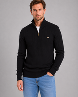 Model wearing the jumper layered over a base layer