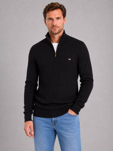 Model wearing the jumper layered over a base layer