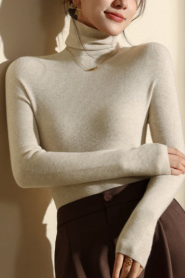 Side profile showing the slim fit silhouette and long sleeves