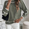 Front view of a green roll neck sweater with contrast accent detailing