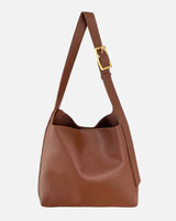 Side profile of the hobo bag showing the curved silhouette and strap attachment
