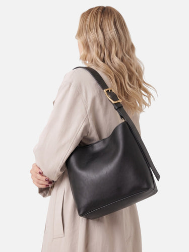 Close-up of the gold-toned buckle and exterior finish of the hobo bag