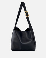 Front view of a rounded hobo bag with a gold-toned buckle and adjustable shoulder strap