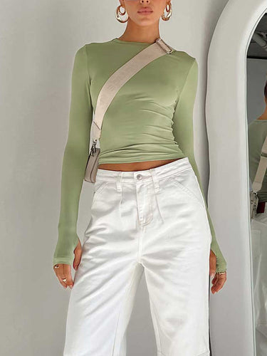 Close-up of the ruched sleeve and thumbhole cuff detail
