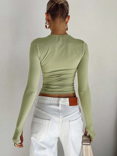 Side view showing the cropped length and fitted silhouette