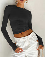 Model wearing the crop top showing the full body ruching