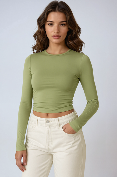 Front view of a ruched long sleeve crop top with thumbhole cuffs