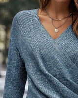 Side view showing the dropped shoulder silhouette and hem length of the jumper