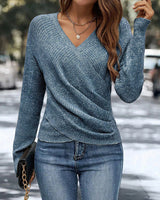 Front view of a ruched V-neck jumper with dropped shoulders and long sleeves