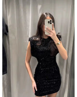 Sequin Dress with Shoulder Pads and Back Cutout