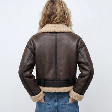 Close-up of the ribbed collar and zip detail on the shearling bomber jacket