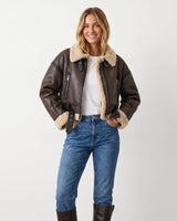 Back view of the cropped shearling aviator jacket with ribbed hem