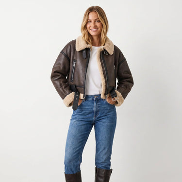Back view of the cropped shearling aviator jacket with ribbed hem