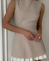 Sleeveless Mini Dress with Pleated Hem