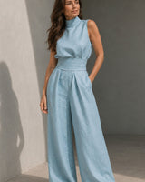Back view of sleeveless jumpsuit in off-white with wide-leg trousers