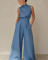 Detail shot of cinched waist and high neckline on wide-leg jumpsuit