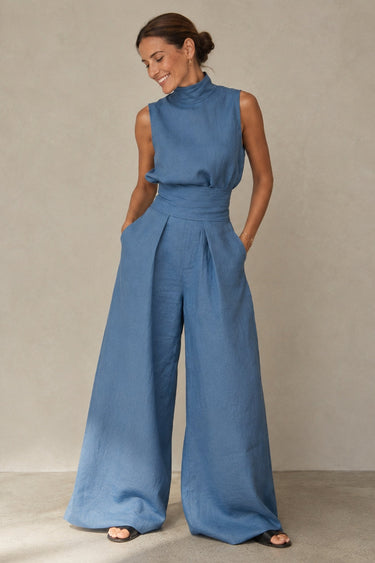 Detail shot of cinched waist and high neckline on wide-leg jumpsuit
