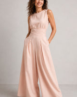 Close-up of wide-leg trouser hem and fabric texture of linen blend jumpsuit
