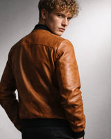 Close-up of the ribbed cuffs on a men's leather bomber jacket
