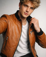 Close-up of the ribbed hem on a men's leather bomber jacket