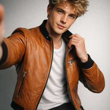 Close-up of the ribbed hem on a men's leather bomber jacket