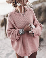Close-up of the chunky knit texture and wide sleeve detail of the oversized jumper