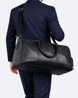 Side view showing the structured shape and adjustable shoulder strap