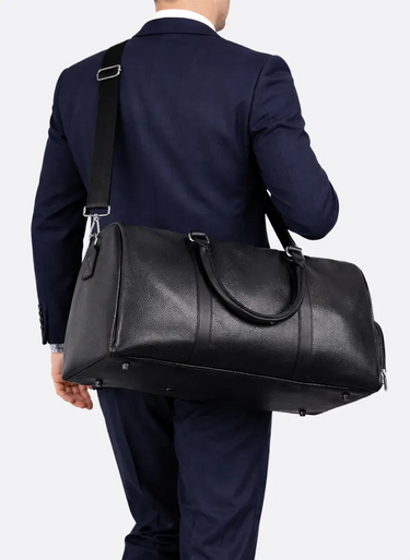 Side view showing the structured shape and adjustable shoulder strap