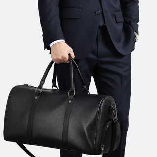 Front view of a spacious duffel bag with zip closure and padded handles