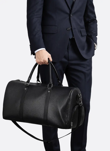 Front view of a spacious duffel bag with zip closure and padded handles