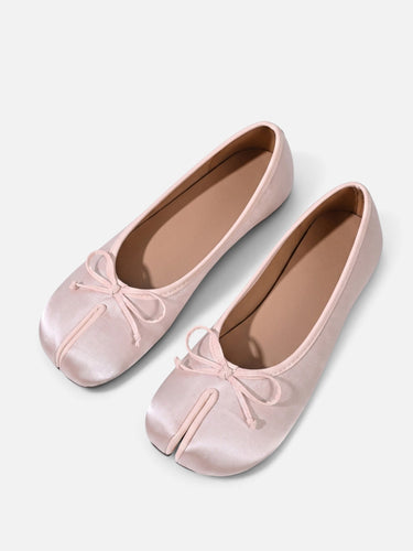 Side view of split-toe ballet flat showing slim profile