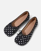 Close-up of bow detail on top of the ballet flat