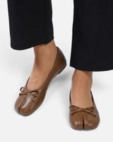 Ballet flat worn on foot, side angle