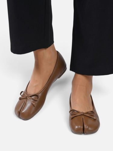 Ballet flat worn on foot, side angle
