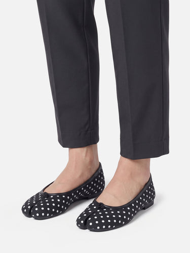 Close-up of bow detail on split-toe ballet flat