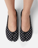Top-down view of polka-dot print on ballet flat upper