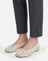 Ballet flat worn on foot showing split-toe and polka-dot print