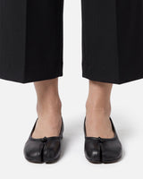 Rear view of the ballet flat showing the low heel and leather lining