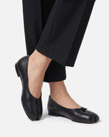 Side profile of the flat sole and sleek silhouette of the ballet flat