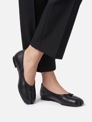 Side profile of the flat sole and sleek silhouette of the ballet flat