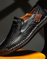 Side view of men's loafers showing low-cut profile and textured outsole