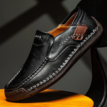 Side view of men's loafers showing low-cut profile and textured outsole