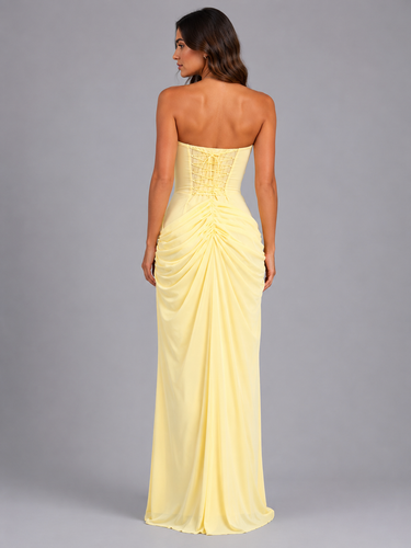 Close-up of ruched waist detail on strapless maxi dress